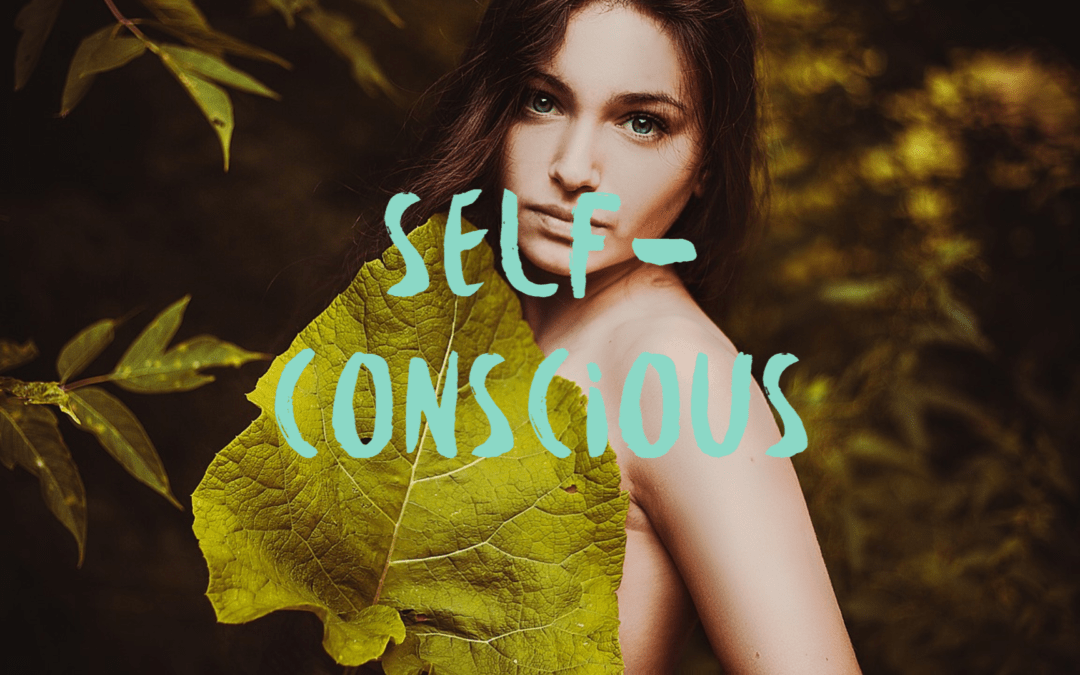 woman outdoors with a leaf covering body and overlay text "self-conscious"